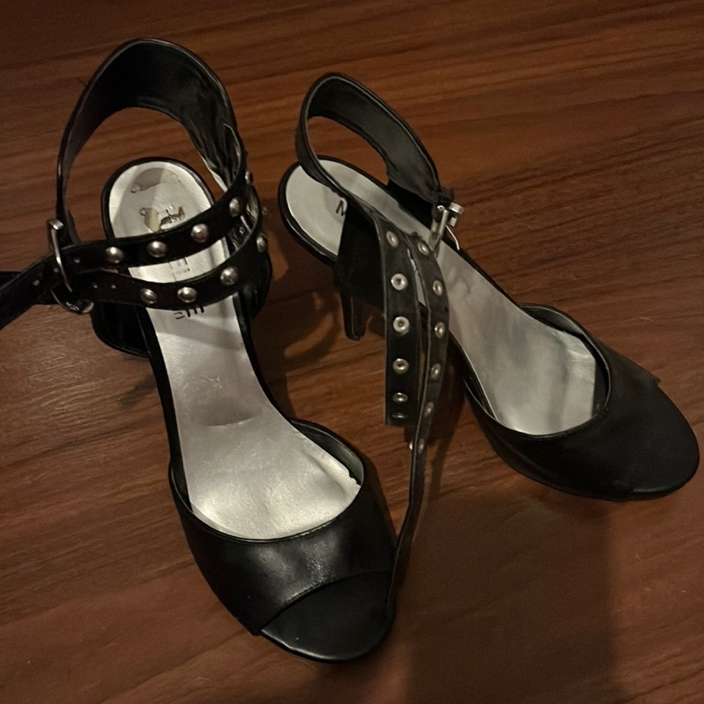 Black heals with black strap around ankle